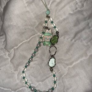 Green labubu phone strap